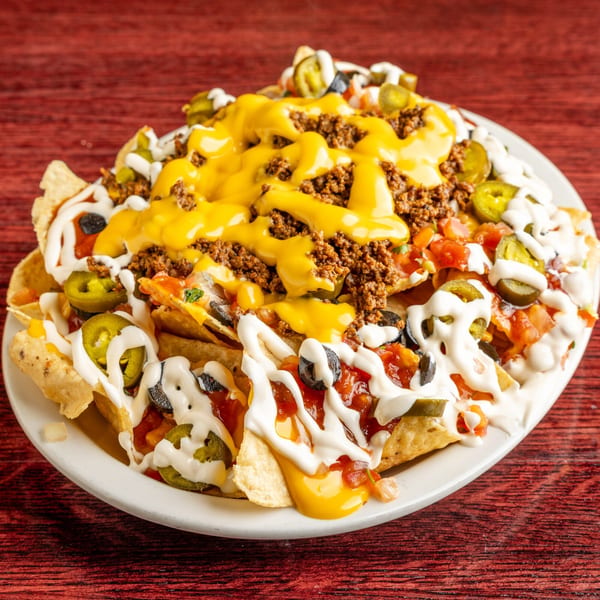 Nally's Kitchen's loaded nachos with ground beef, cheese, jalapeños, olives, and sour cream.